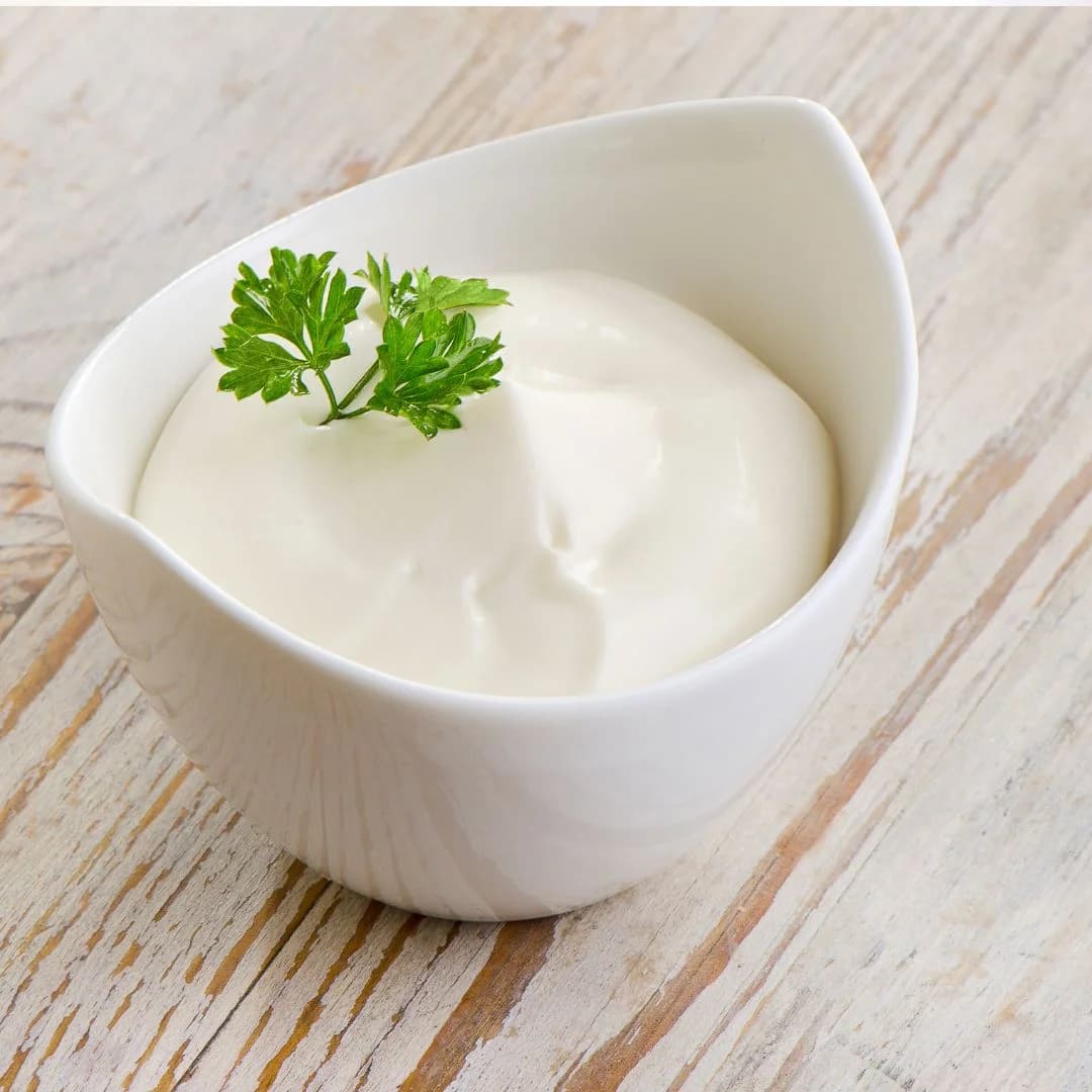 Creamy mayonnaise served in a luxury bowl on a table