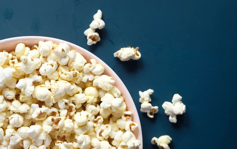 top view of air cooked popcorn served in white plate